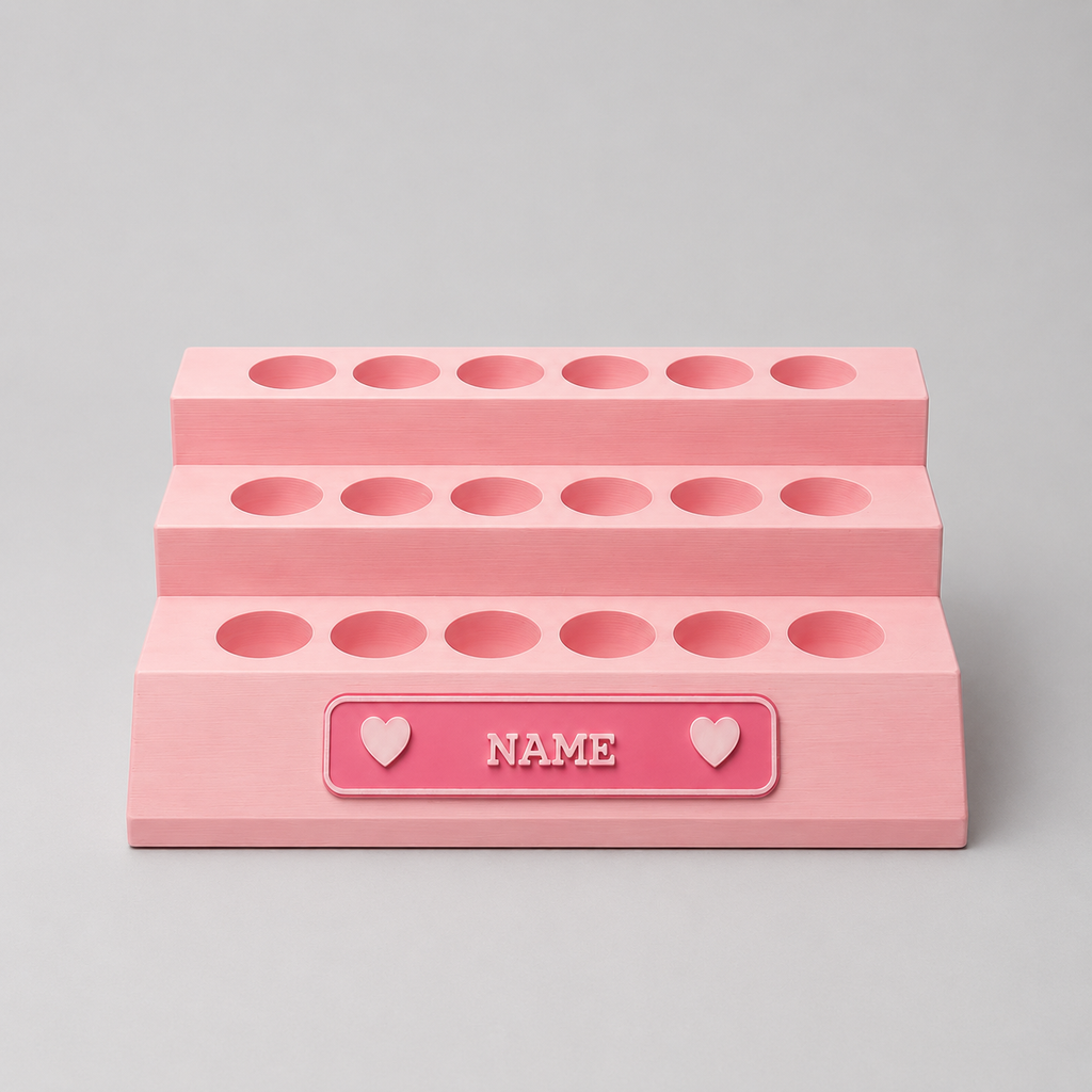 Pink makeup organizer with multiple compartments on a gray background