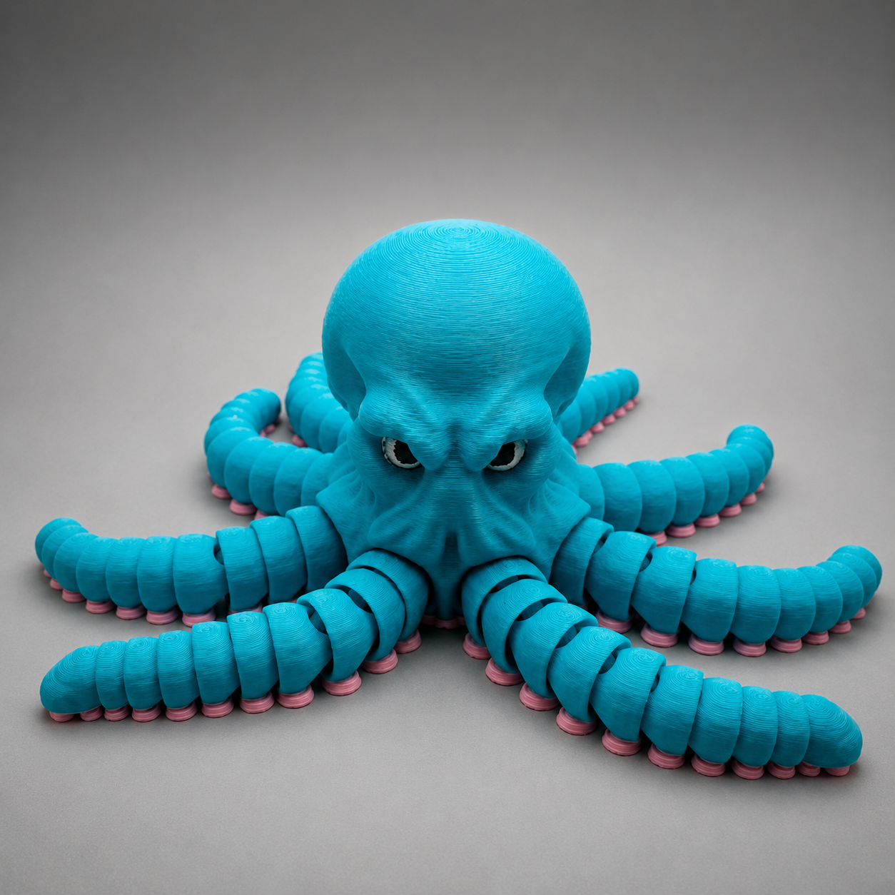 Articulated Octopus figure in teal on white background