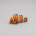 3D printed Teeny Clownfish figure in orange, white and black