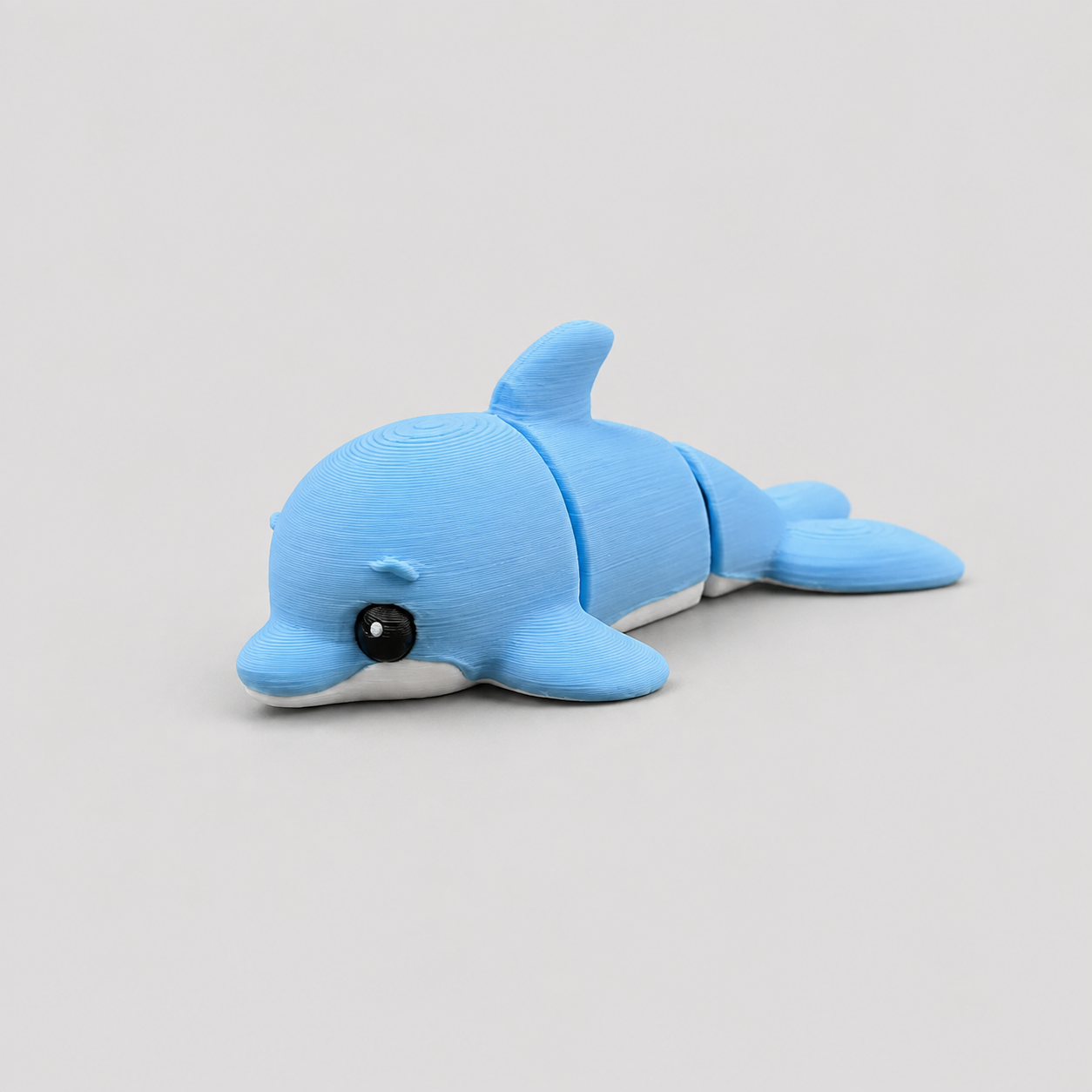 Teeny Dolphin Figure in soft sky-blue with white belly, 3D printed