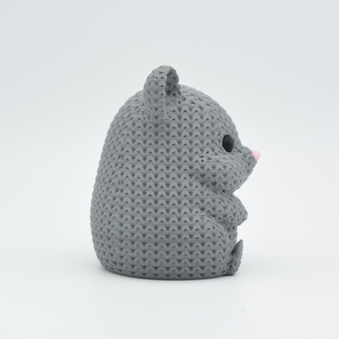 Gray knitted mouse toy on a white background