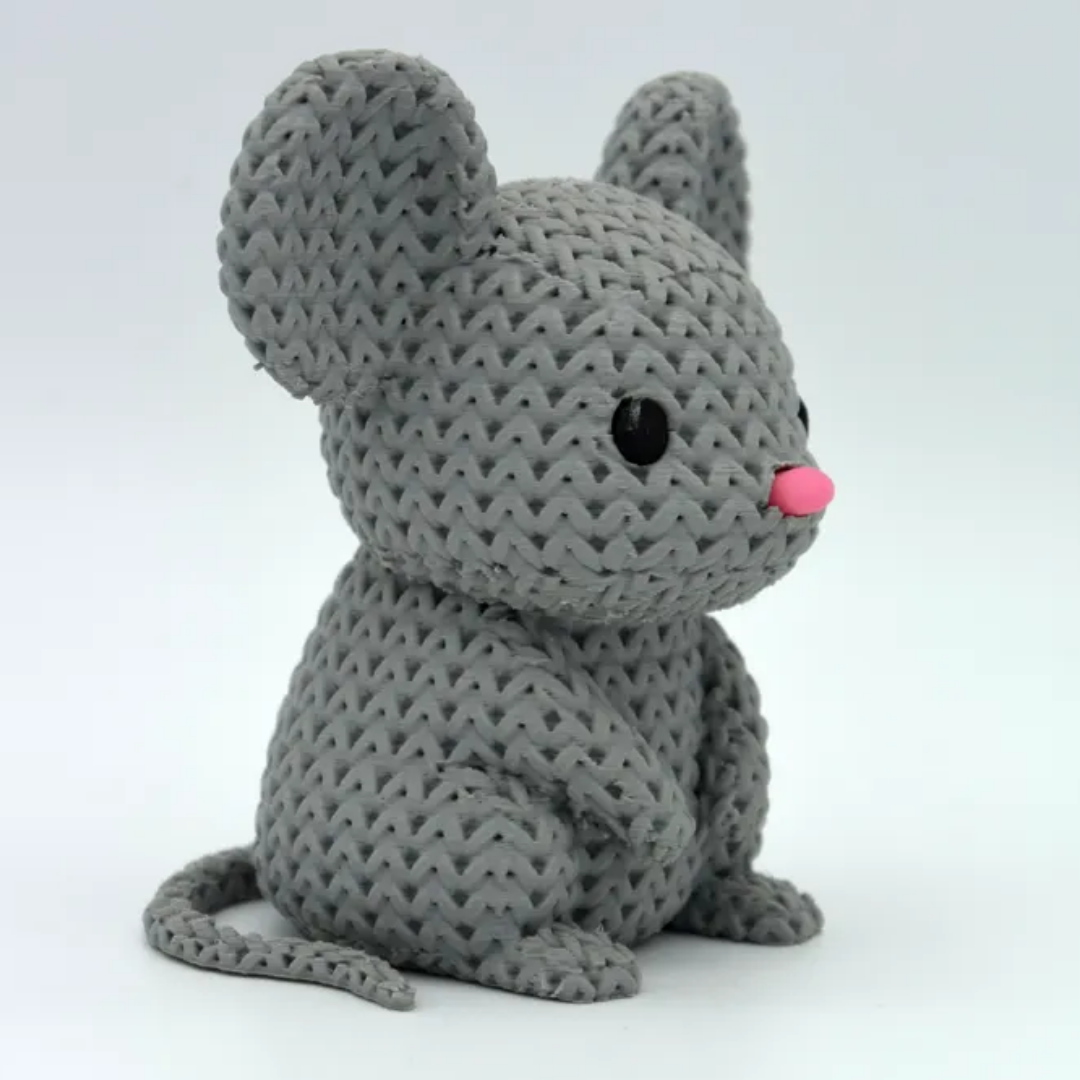 Gray knitted mouse toy on a white background