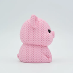 Pink plush toy on a light gray background