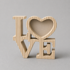 Wooden 'LOVE' decorative piece on a gray background
