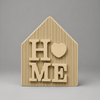 Beige house-shaped decorative item with 'HOME' text on a gray background