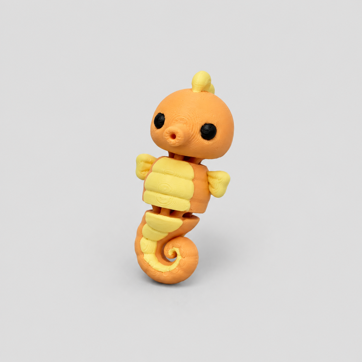 Teeny Seahorse Figure in warm orange with yellow belly plates, 3D printed