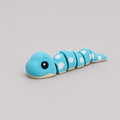 3D printed Teeny Snake figure in sky blue with white cloud markings, lying flat