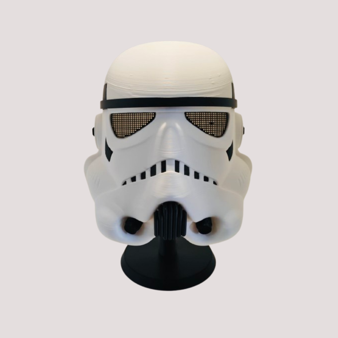 White and black Stormtrooper inspired wearable mask with mesh-style eyes, shown on a black display stand