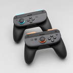 Two black gaming controllers with orange accents on a light gray background