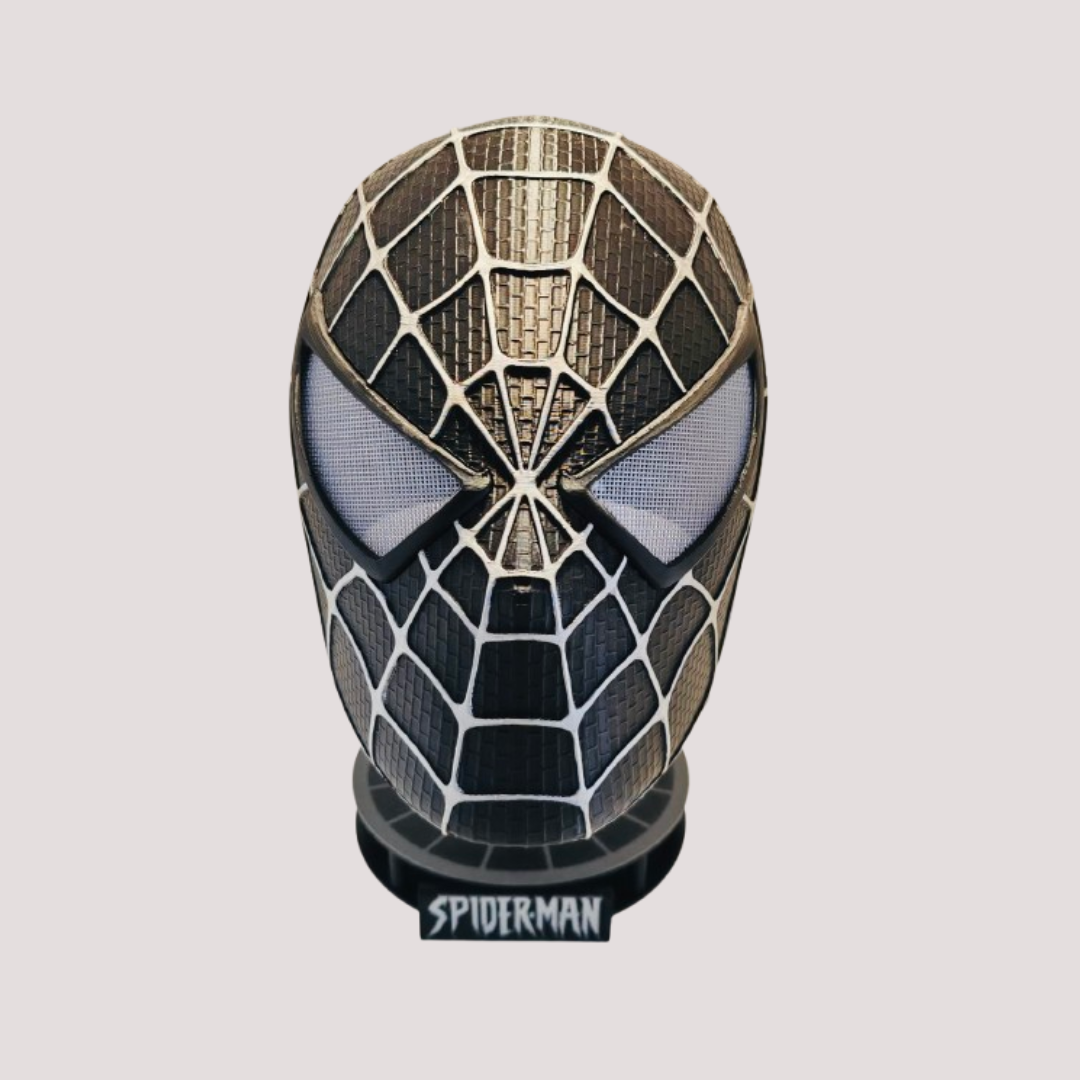 Black Symbiote Spider-Man inspired wearable mask with silver-toned web detailing, shown on its matching display stand