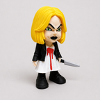 Toy figure with yellow hair, black leather jacket, white dress with red stain, and holding a knife on a light gray background